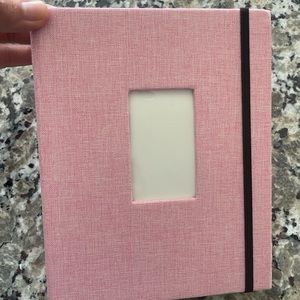 Polaroid camera picture holding photo album